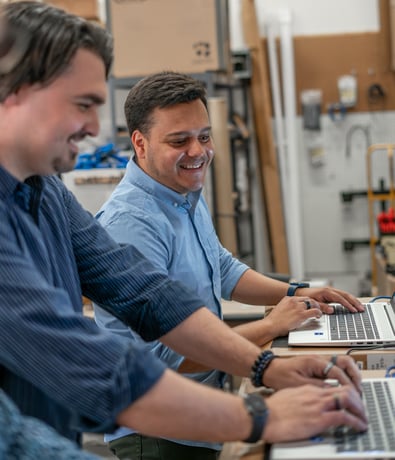IT Technicians Working on Fixing a Laptop in Boston for a Managed Service Client