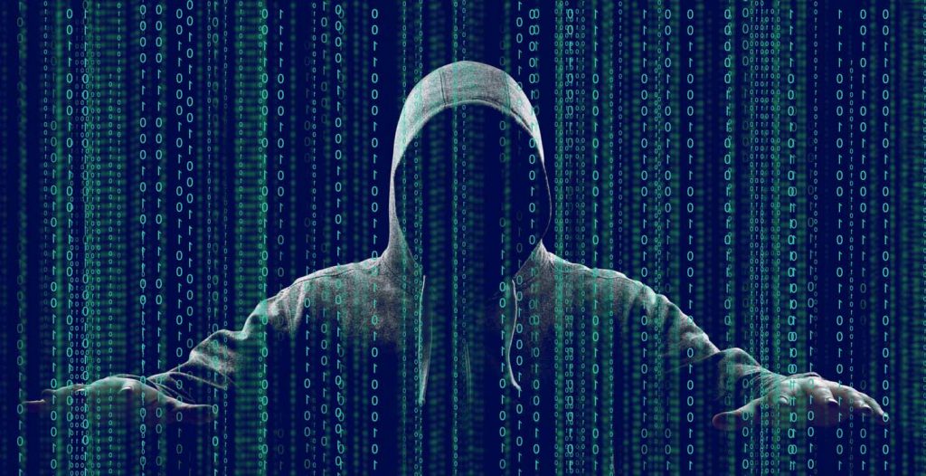 Hooded figure surrounded by binary code on a dark background