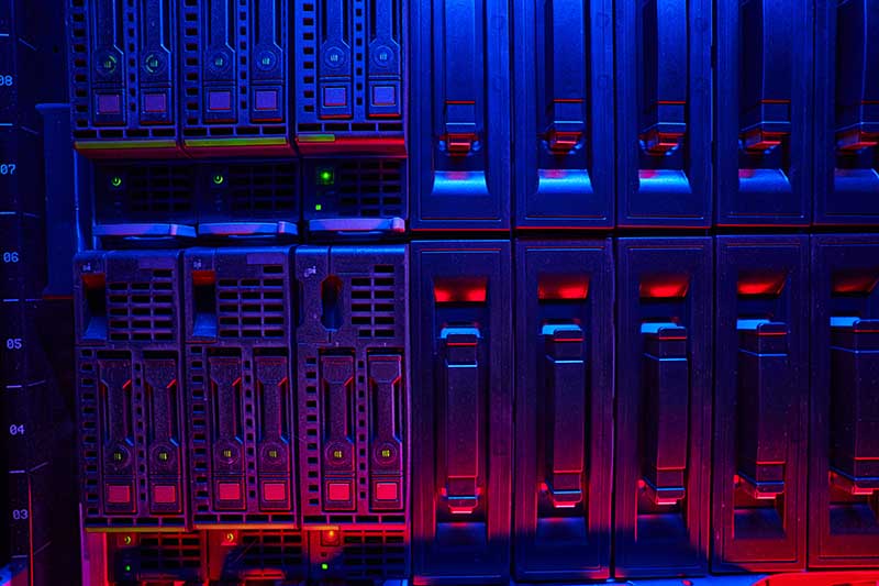 Close-up of server racks with colorful lighting.